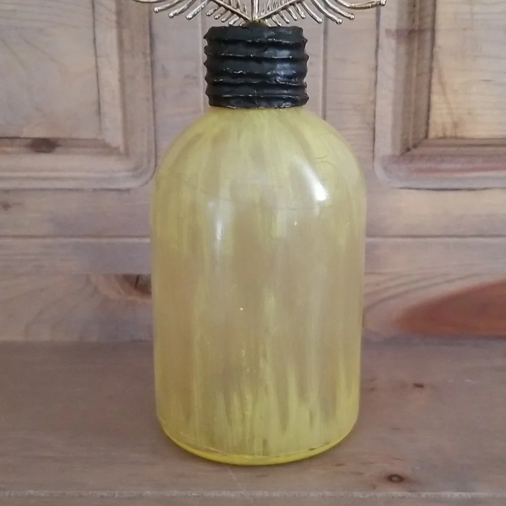 Pottery Barn painted bottle with plume finial